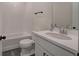 This bathroom features a shower and tub combo with tiled walls, and a vanity with black hardware and a mirror at 841 Keystone Dr, Woodstock, GA 30188