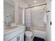 This bathroom features a shower and tub combo with tiled walls, and a vanity with black hardware and a mirror at 841 Keystone Dr, Woodstock, GA 30188
