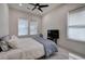 Comfortable bedroom with plush bedding, large windows, and ample natural light at 841 Keystone Dr, Woodstock, GA 30188