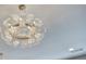 Elegant chandelier hangs from the ceiling at 841 Keystone Dr, Woodstock, GA 30188