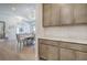 Elegant dining room with modern cabinets, a table set for six, and stylish lighting, perfect for entertaining guests at 841 Keystone Dr, Woodstock, GA 30188