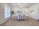 Bright and airy dining room featuring hardwood floors, a chandelier, and a decorative wall at 841 Keystone Dr, Woodstock, GA 30188