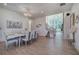 Formal dining room with hardwood floors, chandelier, and view of staircase at 841 Keystone Dr, Woodstock, GA 30188