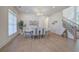 Elegant dining room with hardwood floors, stylish decor, and a view of the staircase at 841 Keystone Dr, Woodstock, GA 30188
