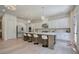 Bright kitchen features an island with seating, marble countertops, and stainless steel appliances at 841 Keystone Dr, Woodstock, GA 30188