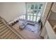 Spacious living room with large windows, fireplace, and hardwood floors at 841 Keystone Dr, Woodstock, GA 30188
