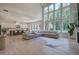Spacious living room with high ceilings, stone fireplace, and view to kitchen at 841 Keystone Dr, Woodstock, GA 30188