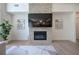 Cozy living room with a stone fireplace, modern decor, and hardwood floors, creating a warm and inviting atmosphere at 841 Keystone Dr, Woodstock, GA 30188