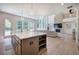 Bright open concept with island seating, a living area with fireplace, and large windows offering lots of natural light at 841 Keystone Dr, Woodstock, GA 30188