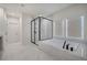 Bright bathroom featuring a modern tub and shower with black fixtures and marble tile at 841 Keystone Dr, Woodstock, GA 30188