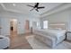 Spacious main bedroom features natural light, tray ceilings, and hardwood floors at 841 Keystone Dr, Woodstock, GA 30188