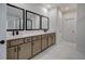 Bathroom vanity featuring double sinks, stone countertops, and modern black fixtures at 841 Keystone Dr, Woodstock, GA 30188