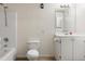 Cozy bathroom features a shower-tub combination and classic vanity at 303 Nottingham Dr, Woodstock, GA 30188