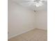 This bedroom features neutral paint, tiled floors, a ceiling fan, and natural light at 303 Nottingham Dr, Woodstock, GA 30188