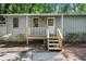 Close-up of the front door and porch featuring freshly painted trim and new porch at 303 Nottingham Dr, Woodstock, GA 30188