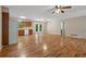 Open-concept living room and kitchen with natural light and wood floors at 303 Nottingham Dr, Woodstock, GA 30188