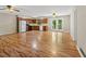 Open-concept layout featuring a kitchen and living area with sleek wood floors at 303 Nottingham Dr, Woodstock, GA 30188