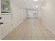 Open floor plan features a tiled living room area with a view into the kitchen at 303 Nottingham Dr, Woodstock, GA 30188