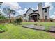 Wide view of the backyard, with a covered patio and partial fence line at 312 Sierra Ct, Mcdonough, GA 30253