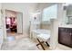 All-white bathroom featuring a soaking tub with views into the main bedroom at 312 Sierra Ct, Mcdonough, GA 30253