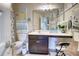 Bathroom featuring a vanity with drawers, toilet, and decorated with artwork at 312 Sierra Ct, Mcdonough, GA 30253