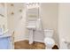 Well-lit half bathroom with modern fixtures, stylish vanity, and decorative accents at 312 Sierra Ct, Mcdonough, GA 30253