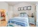 Bedroom with blue furniture, closet access, and vaulted ceiling at 312 Sierra Ct, Mcdonough, GA 30253