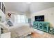 Bedroom with blue furniture, vaulted ceiling, and large window at 312 Sierra Ct, Mcdonough, GA 30253