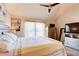 Bedroom with a queen-sized bed, vaulted ceilings, and large windows at 312 Sierra Ct, Mcdonough, GA 30253