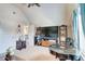 Well-lit bonus room with cozy seating and a television at 312 Sierra Ct, Mcdonough, GA 30253