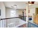 Open landing area with a view of the downstairs and a decorative chandelier at 312 Sierra Ct, Mcdonough, GA 30253