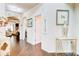 Elegant hallway with hardwood floors, arched doorways, and stylish decor at 312 Sierra Ct, Mcdonough, GA 30253