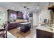 Spacious kitchen with dark cabinets, granite countertops, a central island, and stainless steel appliances at 312 Sierra Ct, Mcdonough, GA 30253