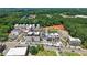 Stunning aerial view showcasing new mixed-use development with modern architecture and lush landscaping at 60 Linton St, Woodstock, GA 30188