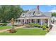 Charming two-story traditional building with a welcoming front porch and well-manicured lawn at 60 Linton St, Woodstock, GA 30188