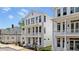 Lovely white home with double balconies and classic architectural features, surrounded by greenery at 60 Linton St, Woodstock, GA 30188