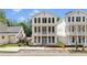 New two-story home with large windows and a covered balcony, under construction at 60 Linton St, Woodstock, GA 30188