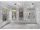 Bright unfinished room boasts large windows and doors that flood the space with natural light at 60 Linton St, Woodstock, GA 30188