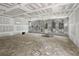 Spacious unfinished room with large windows, a door and plenty of natural light at 60 Linton St, Woodstock, GA 30188