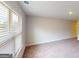 A bright room is filled with natural light that streams in through large windows with blinds at 3402 Milan Ct # 1 Plapprox Sqft 2, Douglasville, GA 30135