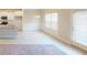 Bright dining area featuring wainscoting, hardwood floors, and a view of the modern kitchen at 3402 Milan Ct # 1 Plapprox Sqft 2, Douglasville, GA 30135