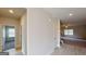 Bright hallway with hardwood floors leading to a living area with stairs and a bedroom at 3402 Milan Ct # 1 Plapprox Sqft 2, Douglasville, GA 30135