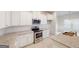 Well-equipped kitchen with granite countertops, stainless appliances and bright white cabinets at 3402 Milan Ct # 1 Plapprox Sqft 2, Douglasville, GA 30135
