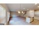 Bright, open living space featuring hardwood floors, an island sink, and large windows with blinds at 3402 Milan Ct # 1 Plapprox Sqft 2, Douglasville, GA 30135