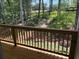 Wooded view from a covered porch, perfect for relaxing outdoors at 3402 Milan Ct, Douglasville, GA 30135