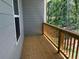 View of the wooded backyard from the covered back porch at 3402 Milan Ct, Douglasville, GA 30135
