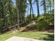 Private backyard with a treeline and green space, ideal for relaxing or outdoor activities at 3402 Milan Ct, Douglasville, GA 30135