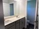Bathroom with double sinks, white counters, and modern fixtures at 3402 Milan Ct, Douglasville, GA 30135