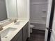 Modern bathroom featuring a double sink vanity and a shower-tub combo at 3402 Milan Ct, Douglasville, GA 30135