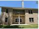 Two-story brick home with a balcony, large windows, and a manicured lawn at 3402 Milan Ct, Douglasville, GA 30135